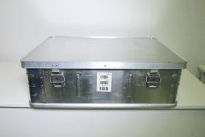 S5001010 Metal storage box, 790x590x245mm, lockable, stackable, supplied with two code padlocks Technical Specifications: The metal box is made of high density, durable lightweight aluminum. The box is robust, lockable, and stackable; it is also water proof, dustproof, and impact resistant and can withstand incredible abuse and extremely harsh environments without chipping, denting, or losing its finish. Material, aluminum, thickness 1mm. 2 Front side locks for code padlocks and 2 Straps for nylon cover The box is supplied with two (2) sets of two (2) each code padlocks, which are fixed inside the cover of the box. The locks are made of a zinc alloy that conforms to STM B86. The padlock is designed to resist the effects of normal everyday use. The body and lid of the box are manufactured in one piece, press-mould metal for compact storage and easy handling. The lid has an interlocking feature to prevent the box from slipping if several boxes are stacked on top of one another. The box is reinforced with diagonal ribs, two on each side of the box that allows for a load bearing of 420 to 480kgs. The base of the box is made with two additional beadings (ribs) to enhance the handling on conveyor belts. The two beadings (ribs) have the same depth as the surrounding profile (industrial tolerances allowing up to plus/minus 1mm, and is located parallel with the longest sides of the box. Weight and Volume: Volume: 0.12 cbm / Weight: 6.5kg (+/- 0.2kg) / Weight pr. gsm: 135kg Part of Early Childhood Development Kit (ECD) Part of the School in a box kit (SIB) School-in-a-Box Part of Recreation Kit