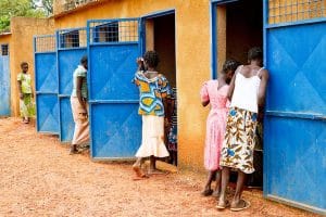 Safiatou (far left) helps to clean the latrines at Sokoroni 'A' Public Primary School. Poor water, hygiene and sanitation contributes to poor health, and consequently, to loss of school days due to diarrhoeal diseases. Moreover, when girls reach puberty, the absence of spatially separated blocks of latrines for boys and girls can cause girls to drop out or miss schoolparticularly during menstruationfor lack of privacy. UNICEF was the first to promote WASH in schools in Burkina Faso. As part of the Child-friendly school (CFS) model, all UNICEF-supported Early Childhood Development (ECD) Centres, primary schools, Non-formal Basic Education Centres (CEBNF) and education centres are all equipped with safe water and improved sanitation infrastructures. These, combined with training in hygienewith particular emphasis on using latrines and proper hand washing with soap and water after using the bathroom and before eatinghave been proven to increase school attendance and improve the health of all students. By bring-ing this information home to their families, children become agents of changeand better healthin their communities. Such improvements will become the norm in primary schools in Burkina Faso as the CFS model is rolled out across the country in the years leading up to 2017.